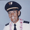 A man in an air force uniform and lei.