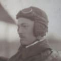 A man in an old photo wearing a helmet.
