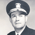 A black and white photo of a man in uniform.
