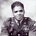 A black and white photo of an african american soldier.