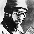 A man wearing a helmet and holding something.