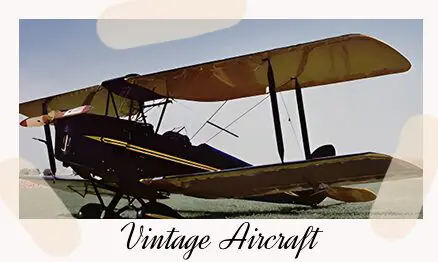 A vintage aircraft is parked on the ground.